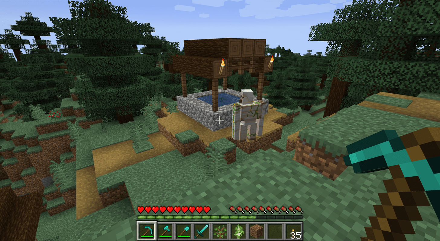 Un golem de ferro en un poble de Minecraft.