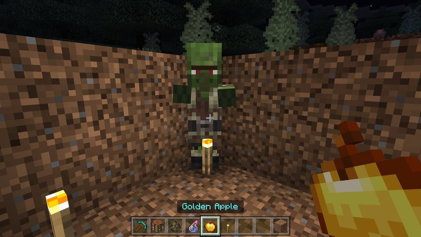 Utilitzant una poma daurada en un poble zombi a Minecraft