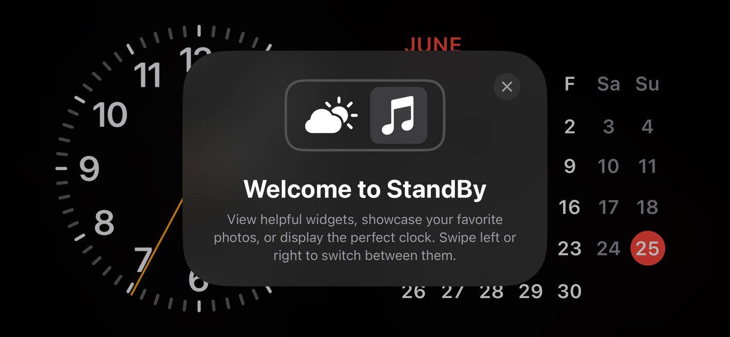 Mode iPhone StandBy dengan pesan selamat datang ditampilkan.